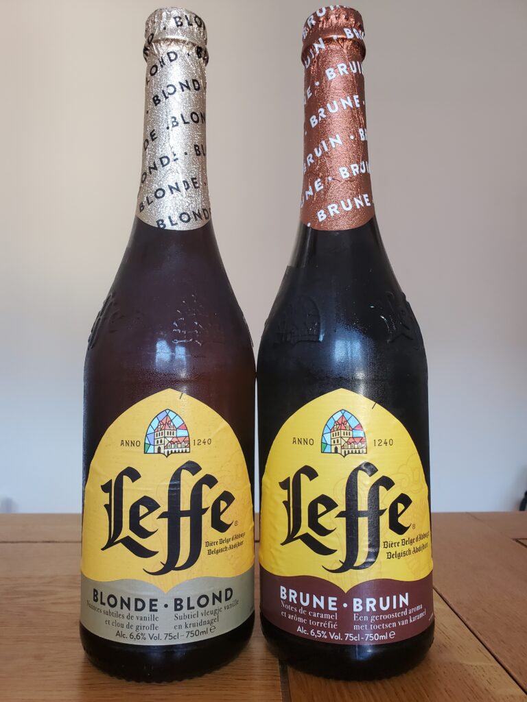 A bottle of Leffe Blonde beer next to a bottle of Leffe Brune beer