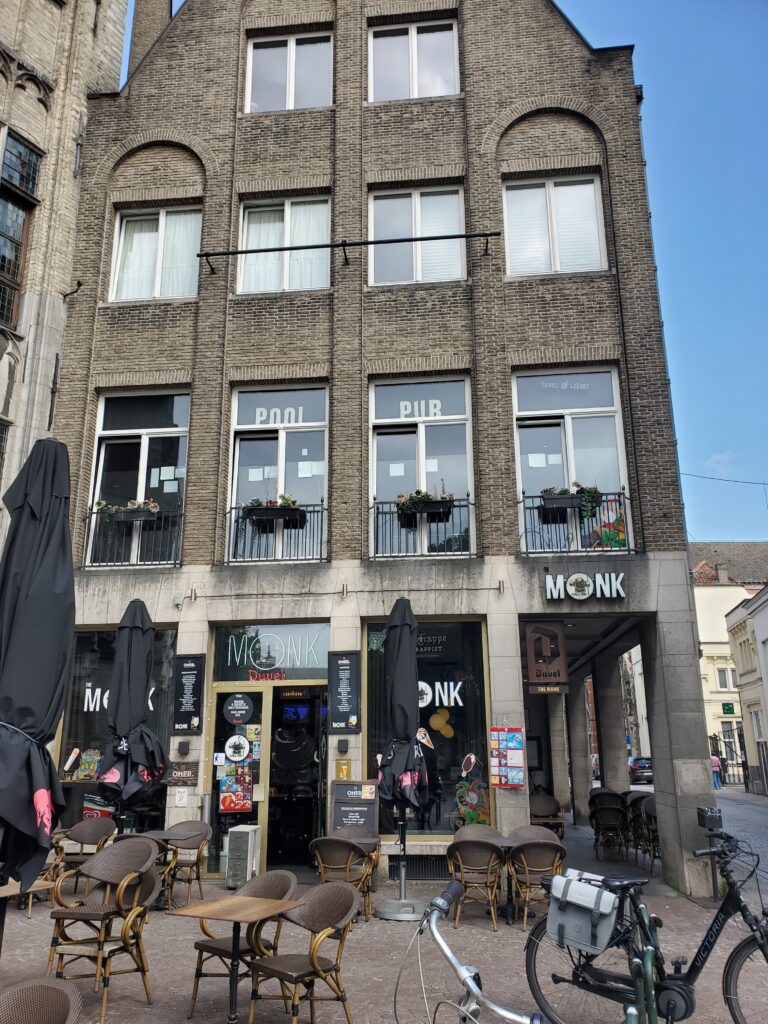 A photograph of the exterior of The Monk pub in Bruges, Belgium